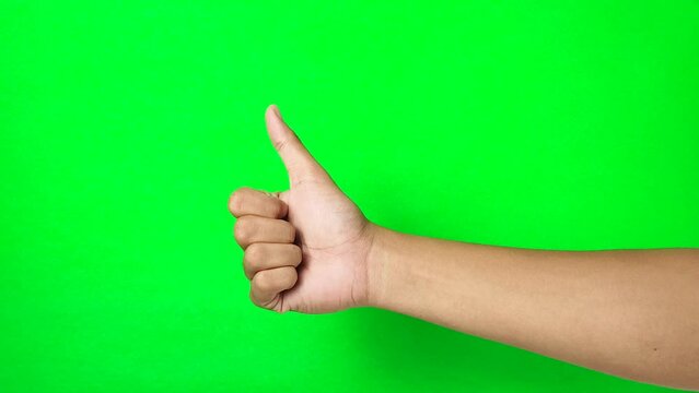 Thumb up gesture isolated on green screen chroma key