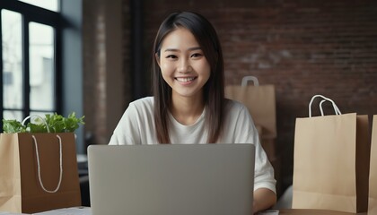  Young Asian girl using laptop, desktop, computer. Online shopping. Shopping bags. Merchandiser. 