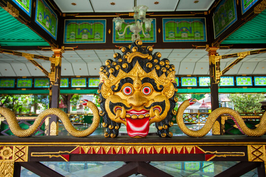 Jogjakarta, Indonesia-11-17-2023: Kalamakara, the god of repelling evil in the Jogja Palace. The head of this god is a decorative ornament in several parts of the palace along with carvings of snakes 