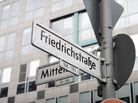 Friedrichstraße in Berlin. Sign with the road name at an intersection. The street is an important part of the infrastructure in the capital city.