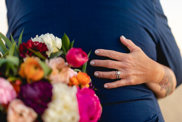 A wedding ring is a finger ring typically worn on the base of the left ring finger, indicates that...