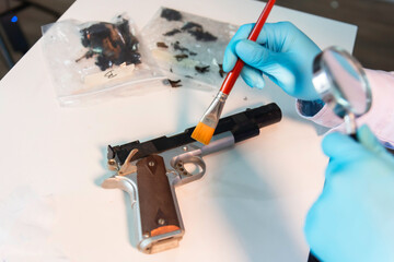 forensics investigator working in lab on crime evidence .