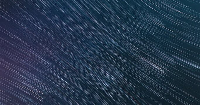 Bewitching Illusion Of Star Trails. Meteors Trace On Night Dark Blue Sky Background. 4k Hyperlapse. Spin Of Unusual Amazing Stars Effect In Sky. Time Lapse, Timelapse, Time-lapse. Soft Colors.