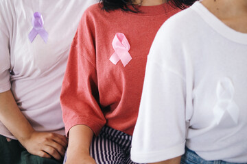 Women wearing t-shirt with various ribbon for breast cancer campaign and domestic violence awareness