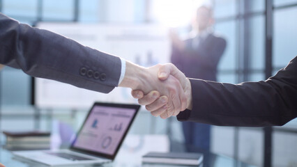 Congratulations and handshake at a successful business meeting