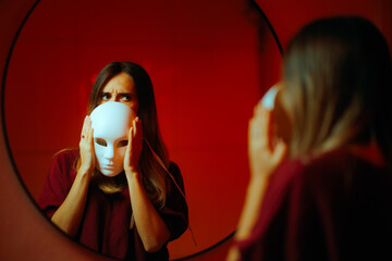 Shy Woman Hiding her Face behind a Theater Mask. Enigmatic girl feeling unhappy being an introvert 
