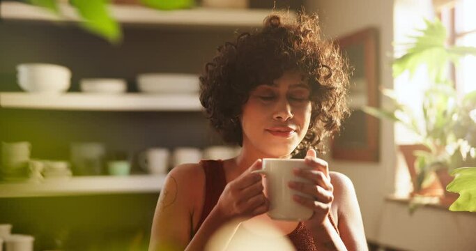 Woman, drinking coffee and daydreaming on morning, calm and relaxing with hot beverage at home. Female person, thinking and peaceful drink or contemplation on weekend, daydream and scent in kitchen