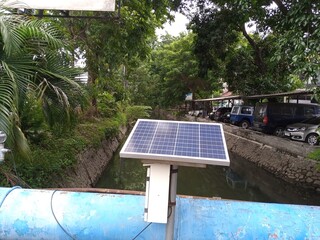 Small solar panels on a bridge side
