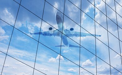 Airplane reflected in skyscraper windows