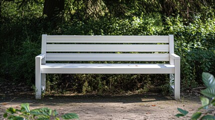 Shot of a white bench in a park.