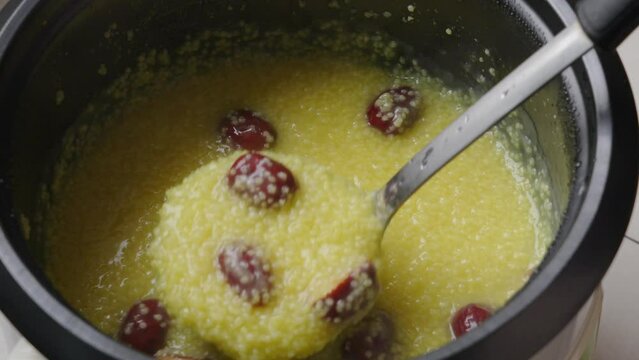 millet congee or millet porridge with jujube in pot	
