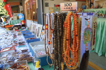 photo of a charity vendor selling mala beads in asia