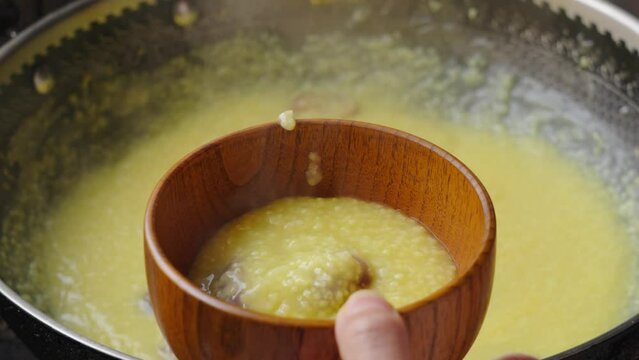 millet congee or millet porridge with jujube in pot.