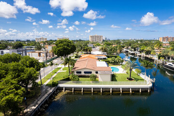 Fototapeta na wymiar North Miami, Florida, USA - Aerial shot displaying upscale waterfront properties with boats docked along the Keystone Islands canal.