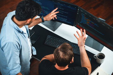 IT developers discussing online software development information on pc screen, creating program...
