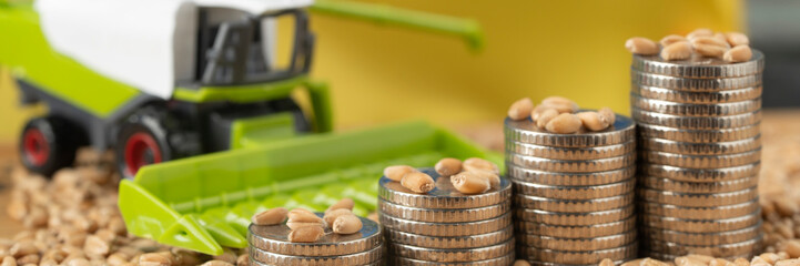 Stacks of coins with a canister of gasoline. Concept of rising fuel prices for agricultural...