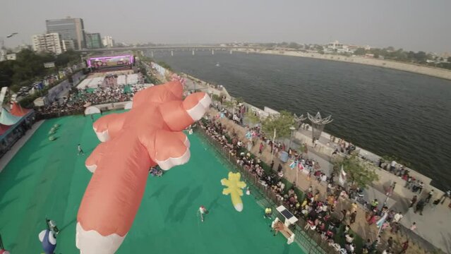 The video showcases the vibrant and lively atmosphere of the Ahmedabad International Kite Festival, capturing the joy and enthusiasm of participants and spectators alike. The festival takes place in