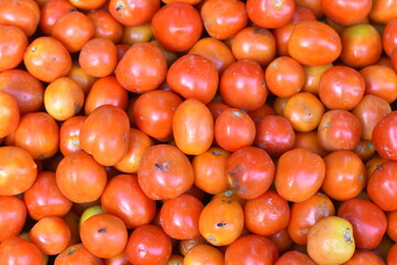 Delicious red tomatoes. Summer farm market trays farm full of organic vegetables It can be used as a background. (Selective focus)