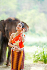 Portrait of Beautiful rural Thai woman wear Thai northern traditional dress for phot shoot on Asian...