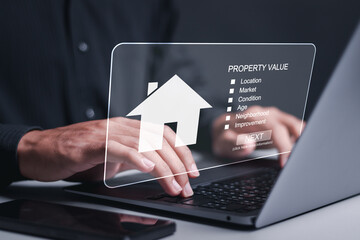 Property value and real estate concept. Person using laptop choose house to buy and different...