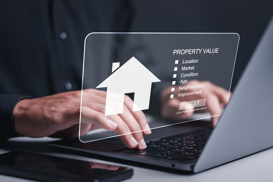 Property value and real estate concept. Person using laptop choose house to buy and different offers of property online.