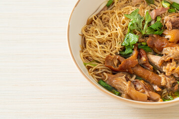 Stewed pork leg noodles in brown soup