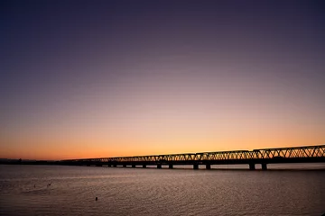 Tuinposter 朝日に染まる木曽川大橋 © Kazuyoshi  Ozaki