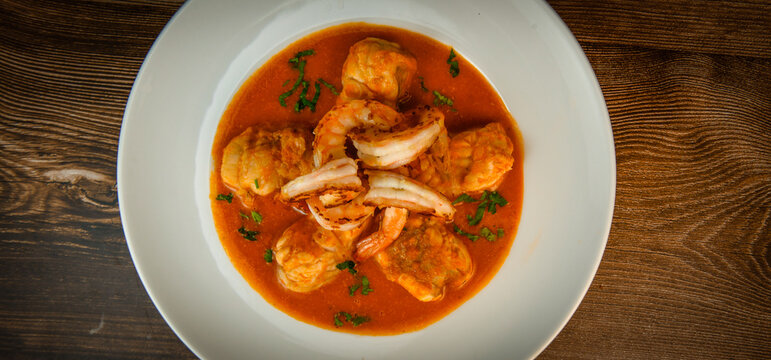 Recipe for Armorican-style monkfish tail, prawns, flambees with cognac, High quality photo