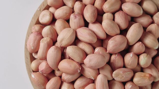 peeled raw peanut kernel on table.