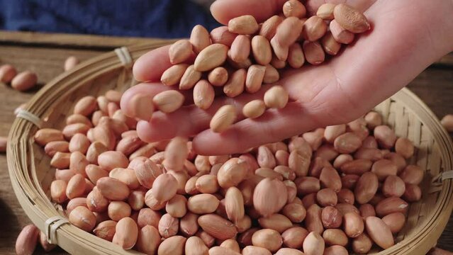 peeled raw peanut kernel on table.