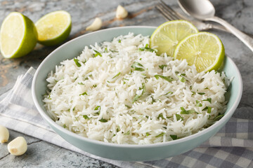 Organic cilantro lime rice with garlic and zest close-up in a bowl on the table. Horizontal