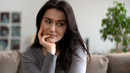 woman  sitting on sofa at home