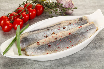 Marinated herring fillet with green onion