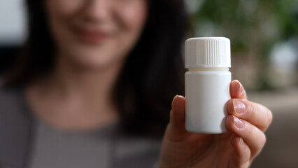 Fototapeta na wymiar woman having medicine pill