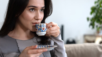 woman holding a cup of coffee