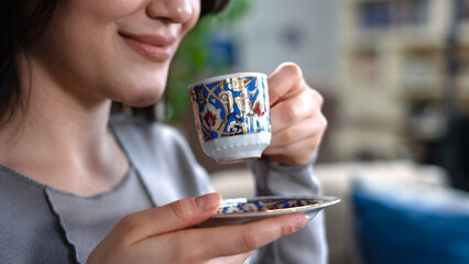 woman holding a cup of coffee