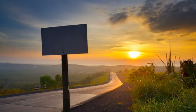 Blank bill board beside highway background sun set view
