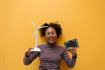 professional African female engineer or environmentalist. Cheerful technology developers hold solar...