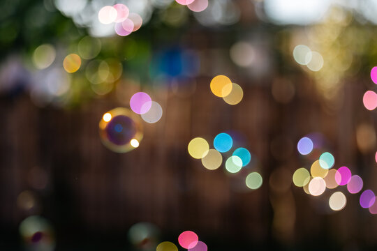 Soft focus background image of bubbles floating in golden morning sunlight