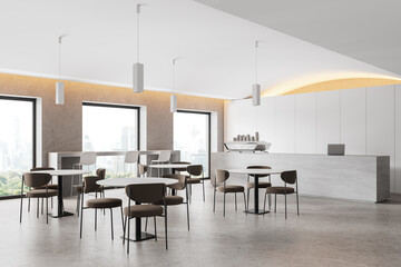Stylish cafeteria interior with bar island, dining space and panoramic window