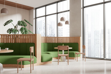 Obraz premium Stylish cafe interior with chairs and sofa in row near panoramic window
