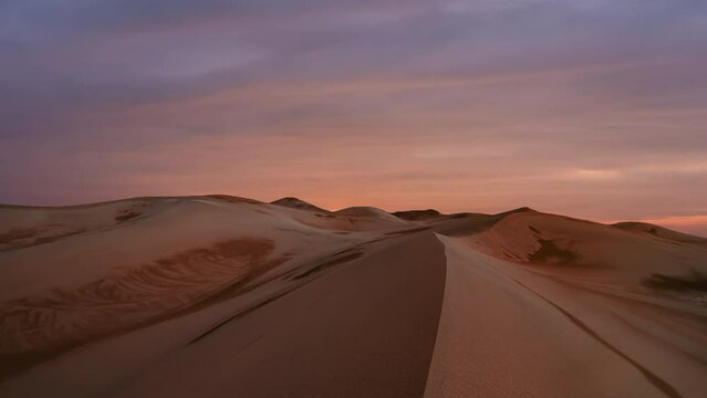 Timelapse of sunset over the sand dunes in the desert. Rub' al Khali desert