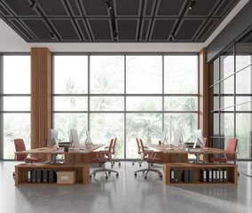 Cozy workplace interior with desk and pc monitors, panoramic window