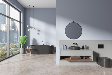 Blue hotel bathroom interior with sink and tub, panoramic window