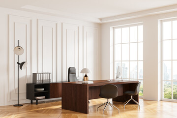 Classic office interior with workplace, work desk with pc computer near window