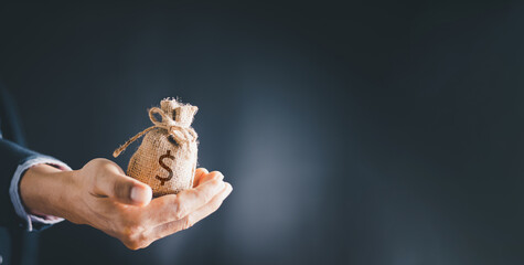 Man hands holding money bags, saving money wealth and financial concept, Business, finance,...