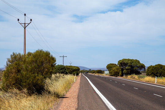 Country bitumen highway and powerlines