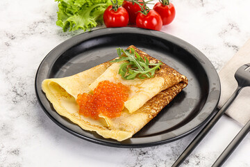 Russian pancake with red caviar
