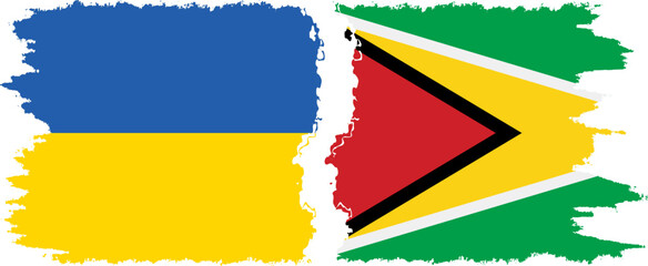 Obraz premium Guyana and Ukraine grunge flags connection vector