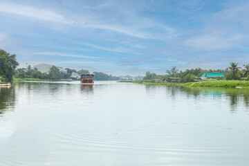 Tourists boat of bangkok crosses the Nakhon Chai Si River